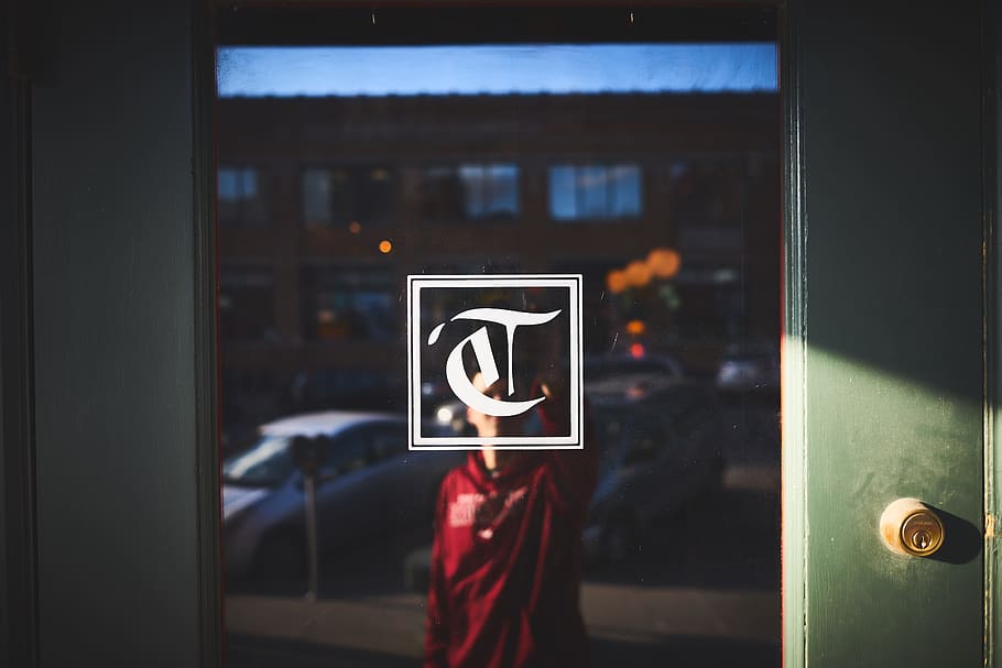 man, guy, door, glass, writing, lettering, building, street HD wallpaper