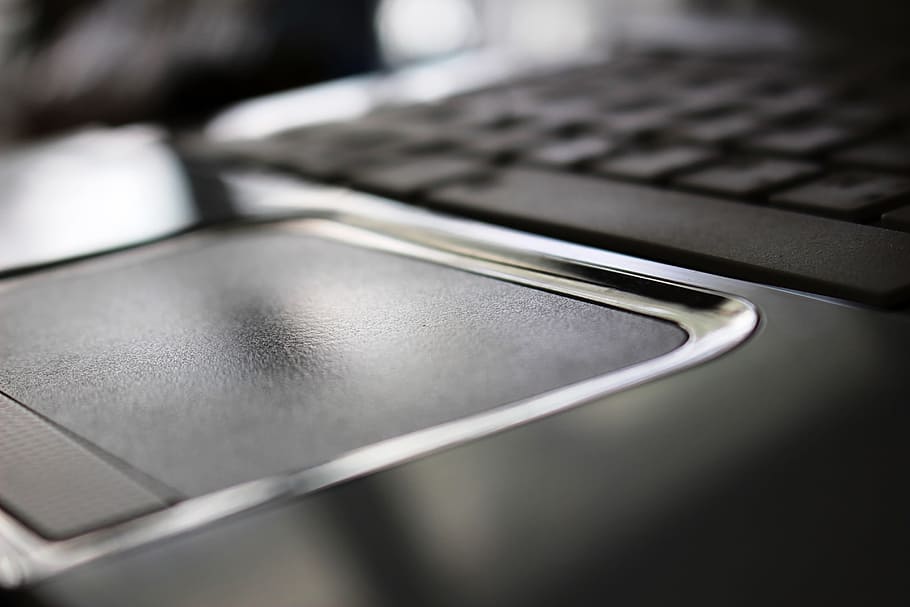 Close-up detail of a white laptop computer mouse pad, closeup HD wallpaper