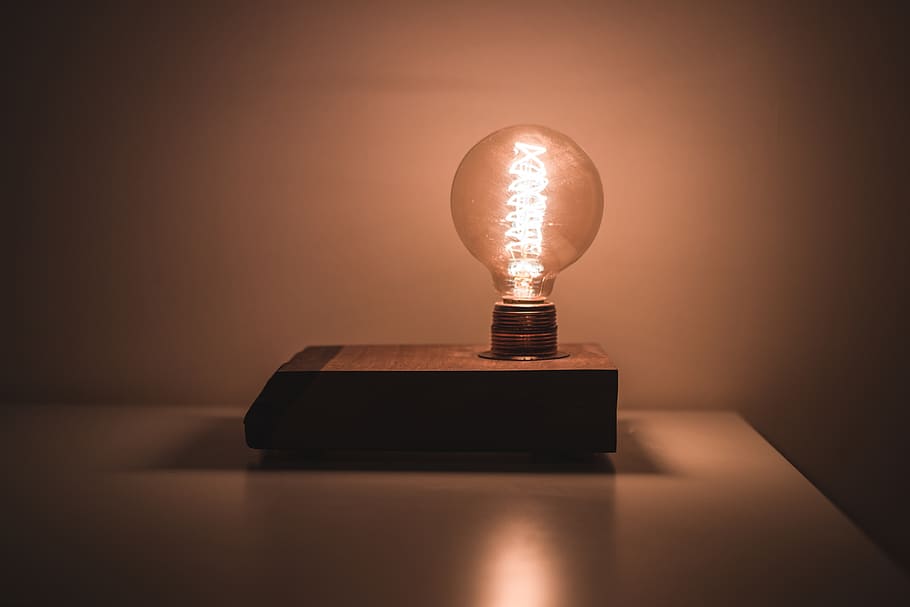 Light Bulb on White Desk Turned on, art, close-up, conceptual HD wallpaper