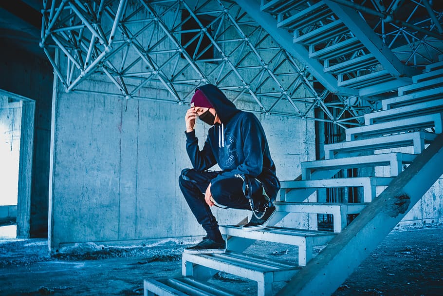 man sitting on white concrete stairs, cyberpunk, vaporwave, portrait