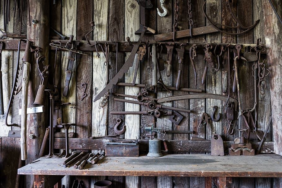 Black Metal Tools Hanged on a Rack Near Table, craft, monochrome HD wallpaper