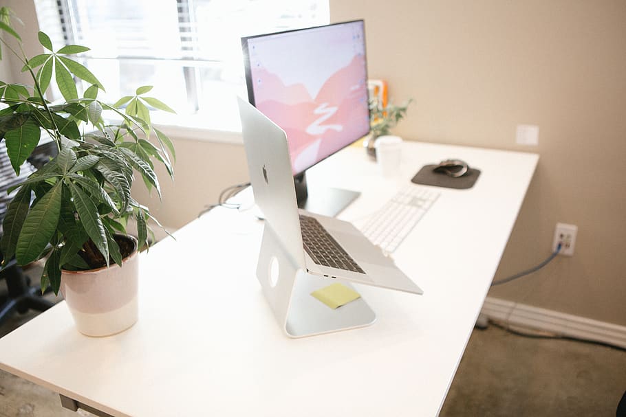 MacBook Pro placed on brown table, furniture, desk, computer HD wallpaper