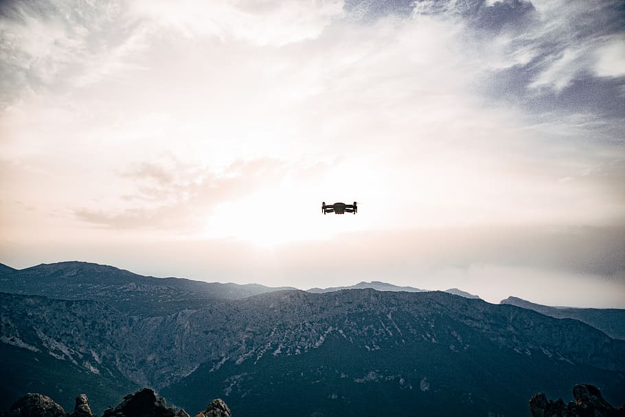 quadcopter on sky, mountain, flying, transportation, mode of transportation HD wallpaper