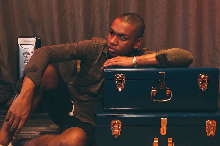 Man Leaning on Blue Suitcase, bald, casual, container, facial expression HD wallpaper