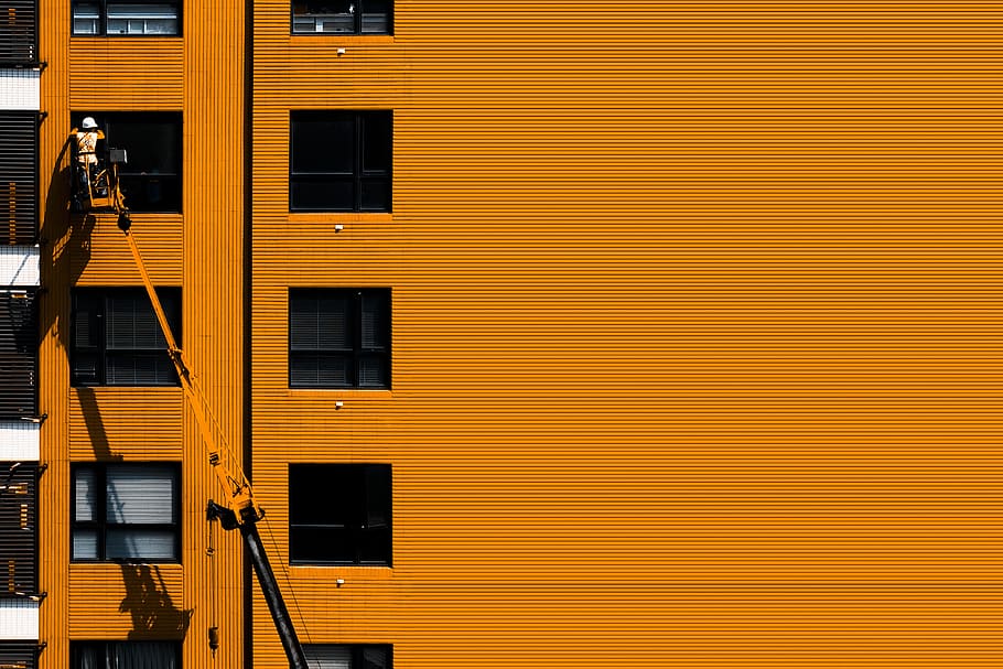 Orange Concrete Building, architecture, cherry picker, person HD wallpaper
