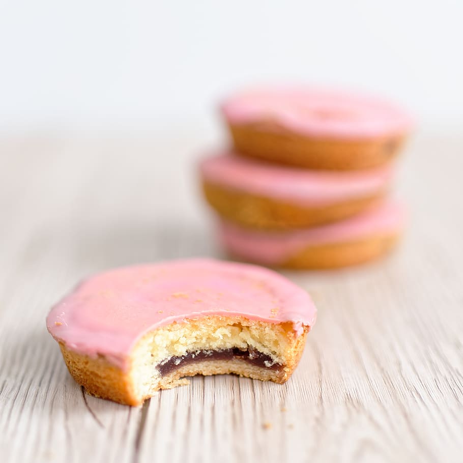 Selective Focus Photography of Bitten Cake on Table Near 3 Stacks of Pastry HD wallpaper