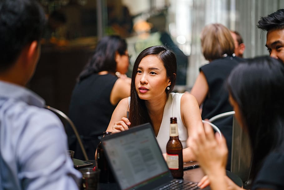 Woman Wearing White Top Sitting Near Table With People, bar, beer HD wallpaper