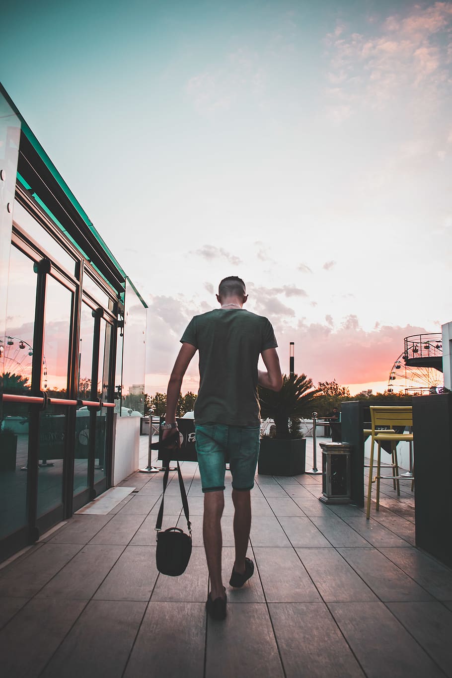 man holding black sling bag while walking, person, people, human HD wallpaper