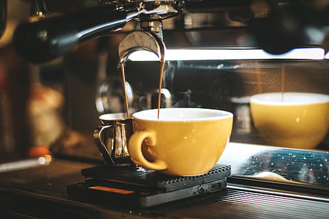 Espresso Machine Pouring Coffee Cups Blurred Background Closeup