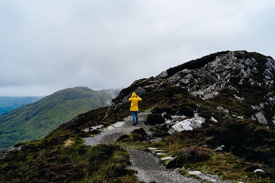 person standing on mountain, apparel, clothing, human, coat, raincoat HD wallpaper