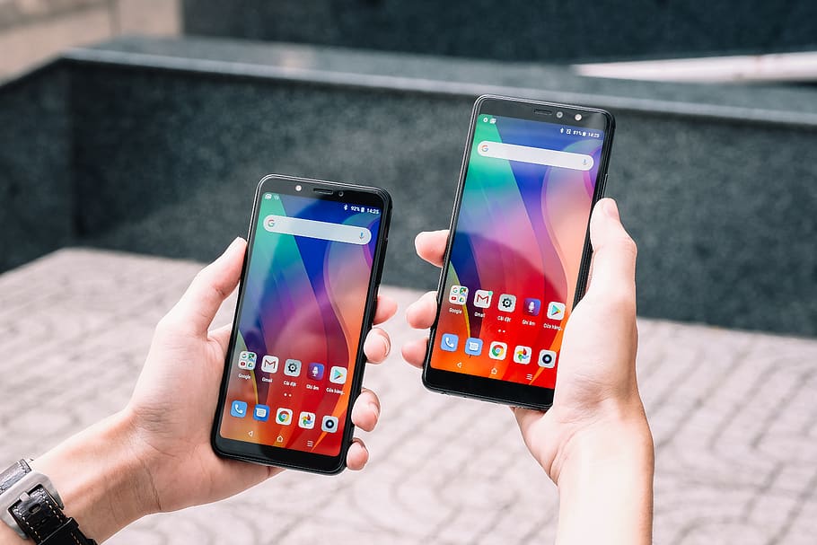 two black smartphones turned on, technology, wireless technology HD wallpaper