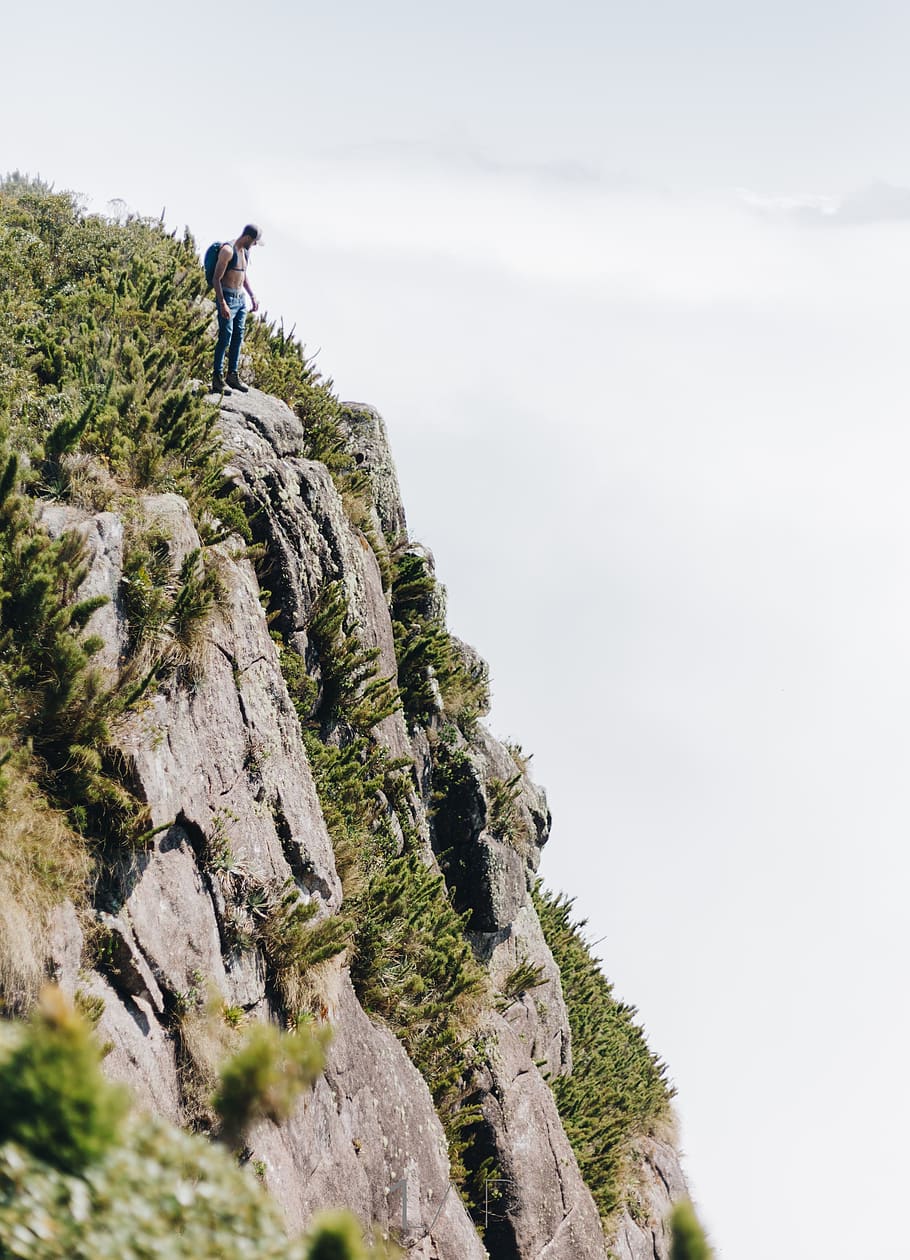 Man Standing on Cliff, action, adventure, backpacker, climb, climber HD wallpaper