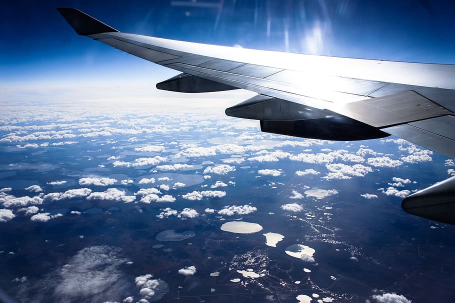 flight, daytime, sky, wing, plane, blue, lake, mountains, cities HD wallpaper