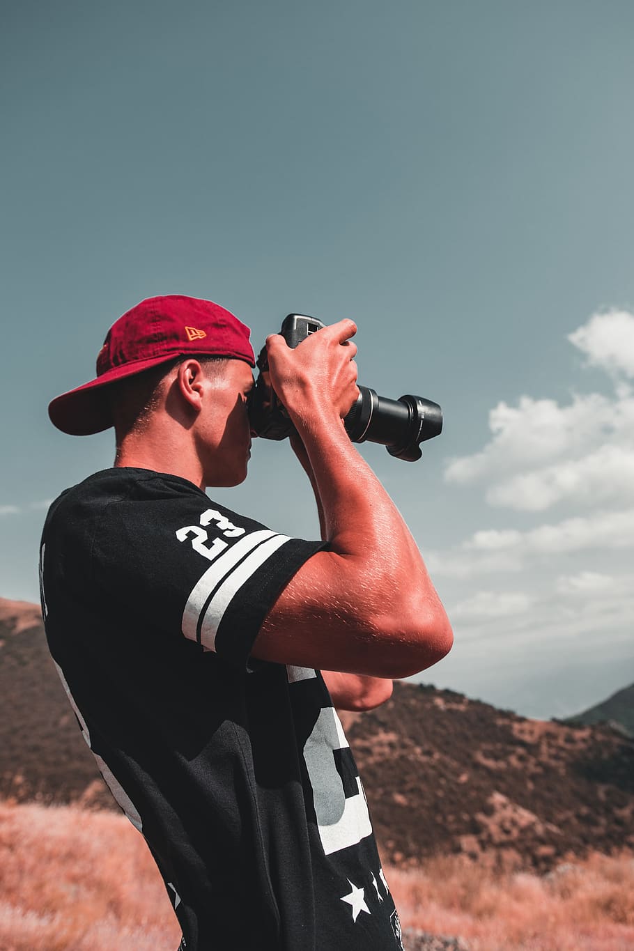 man using DSLR camera outdoors during daytime, sky, real people HD wallpaper
