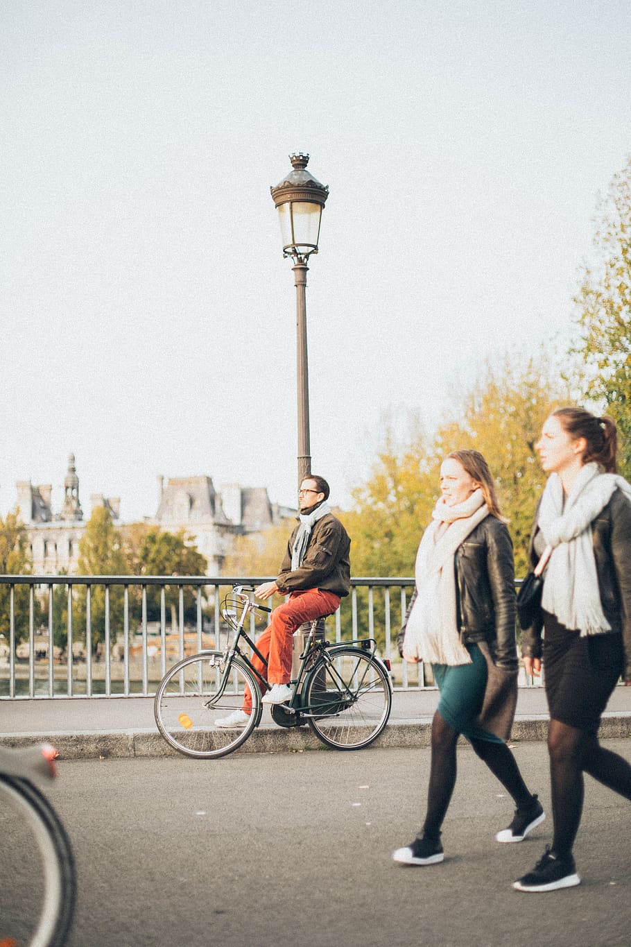 2 Woman Walking Near Man Riding Bike Near Lamp Post, action, bicycle HD wallpaper