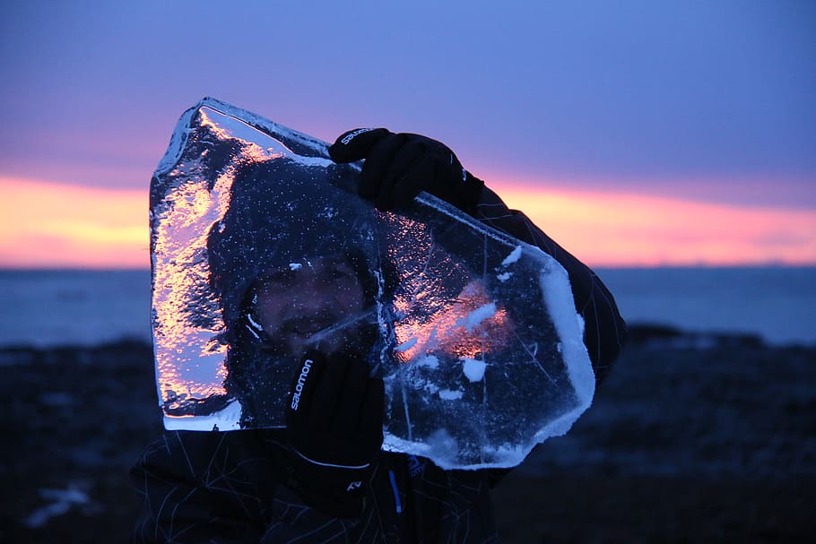 Person Carrying Block of Ice While Standing on Hill, dawn, evening HD wallpaper
