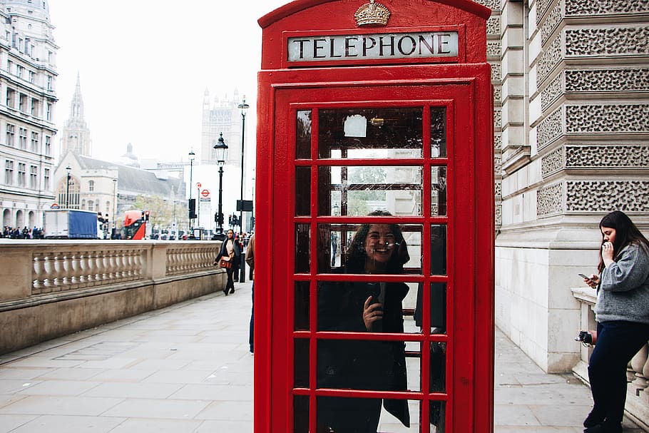 woman using Telephone box, architecture, communication, built structure HD wallpaper