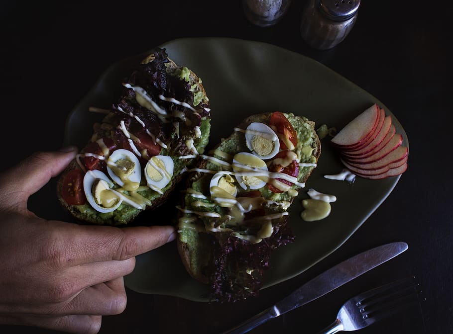 sliced bread with egg toppings on plate, hand, human hand, food HD wallpaper