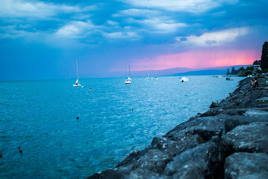 Boat Sailing on Body of Water, boats, clouds, raining, rocks HD wallpaper