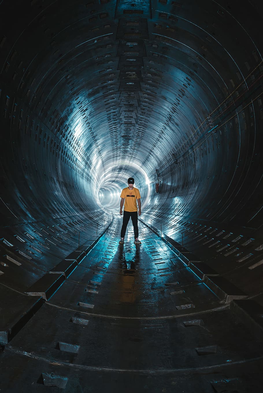 low light photography of man standing inside tunnel, male, reflection