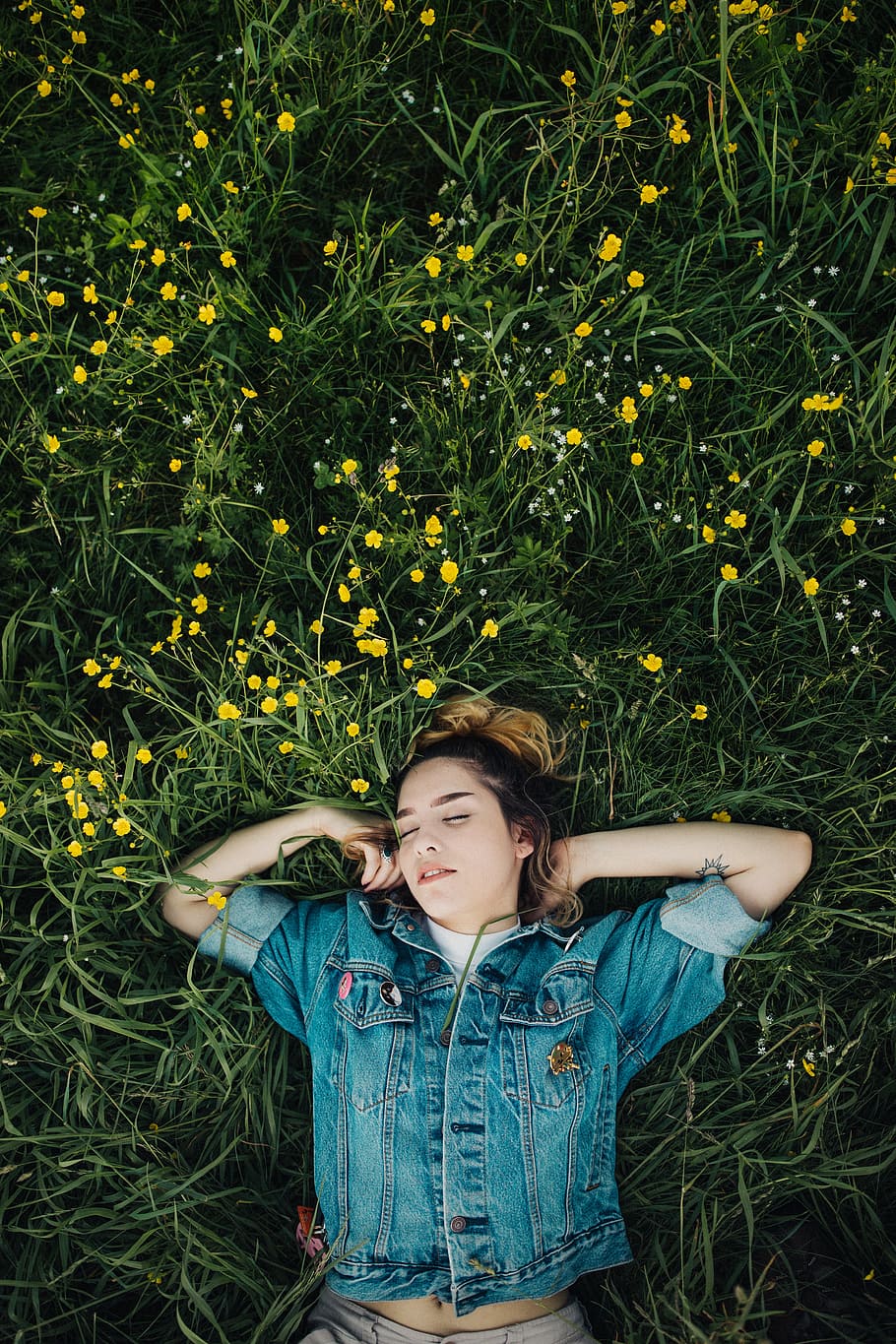 woman lying on grassland, female, field, green, eyes closed, denim, HD wallpaper