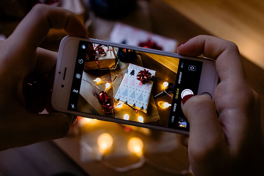 Hd Wallpaper Person Using Iphone Taking Picture Of Gift Box Christmas Present Wallpaper Flare