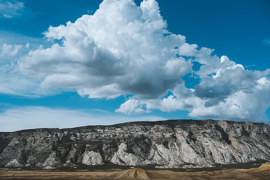 rock cliff under cloudy sky, cloud - sky, beauty in nature, scenics - nature HD wallpaper