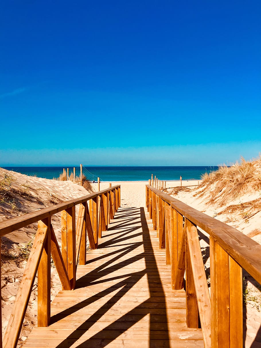 Empty Brown Wooden Dock Towards Beach, idyllic, jetty, ocean HD wallpaper