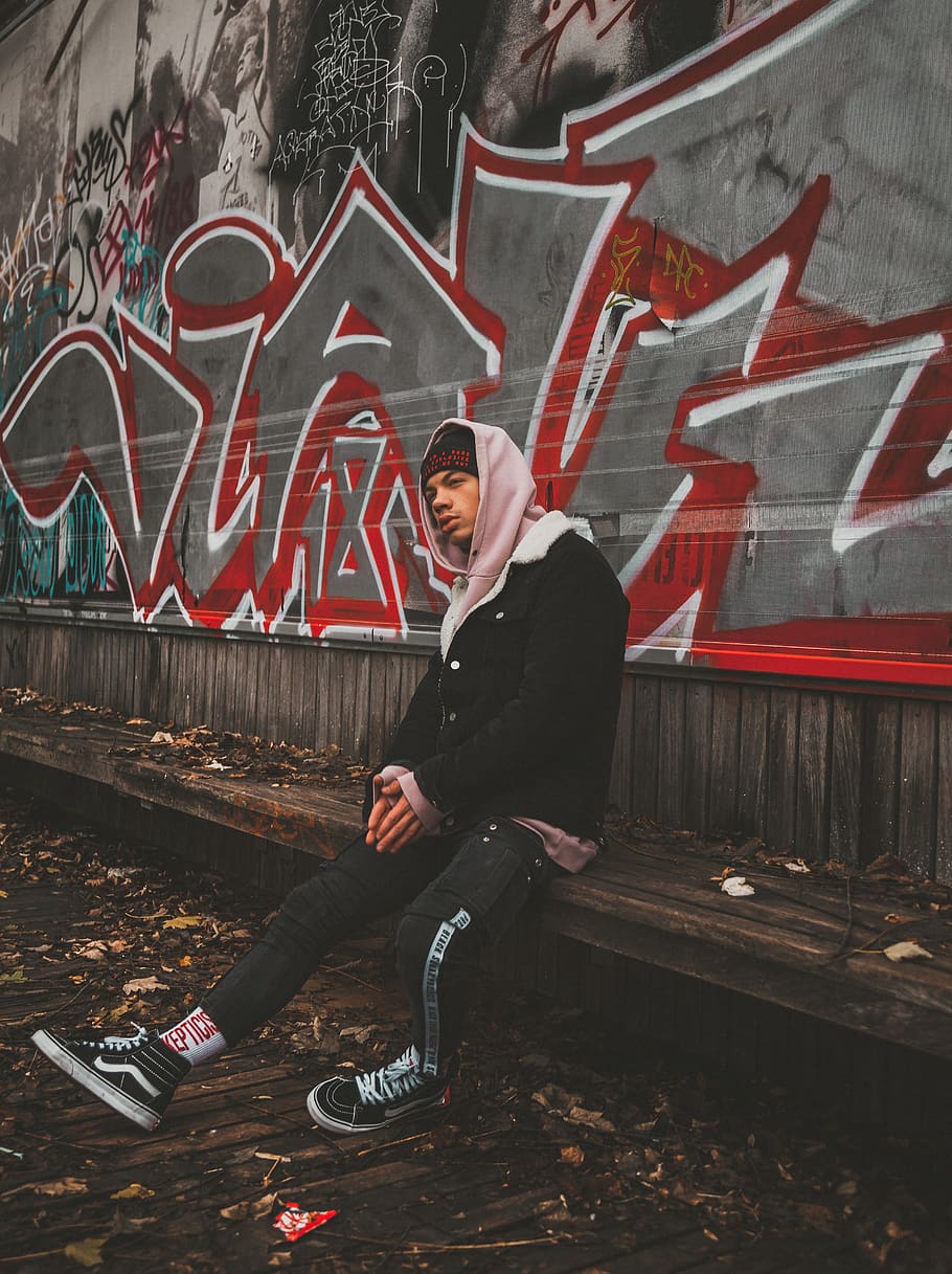 man sitting down on bench, one person, graffiti, lifestyles, full length HD wallpaper