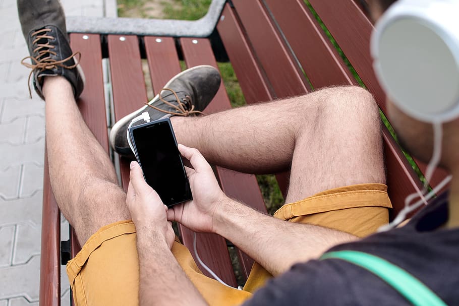 Young guy on the bench enjoying the music, men, human body part HD wallpaper