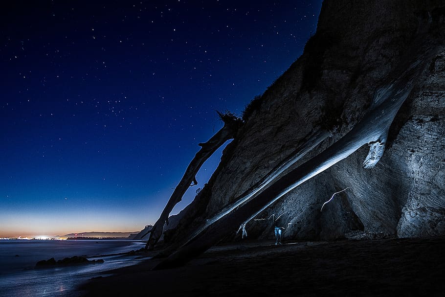 People Near Cave and Seashore, dark, long-exposure, night, sky HD wallpaper
