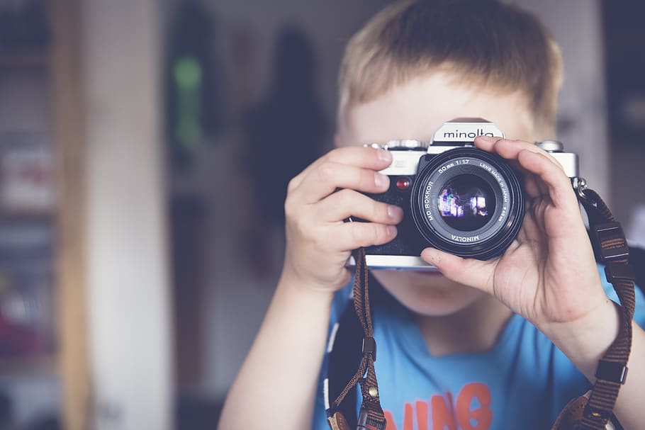 Boy in Blue Crew Neck T Shirt Taking Photo Using Minolta Dslr Camera HD wallpaper