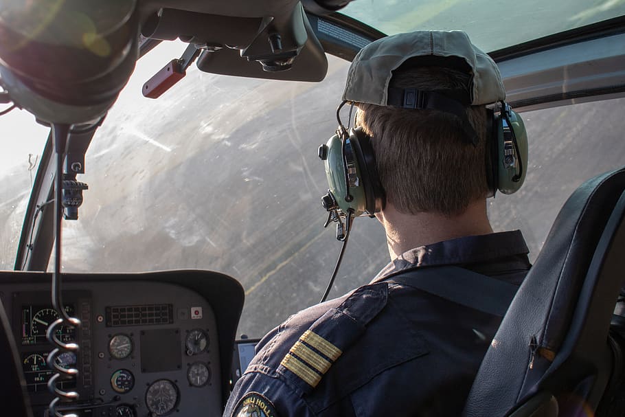 man driving helicopter, person, cockpit, human, people, tire HD wallpaper