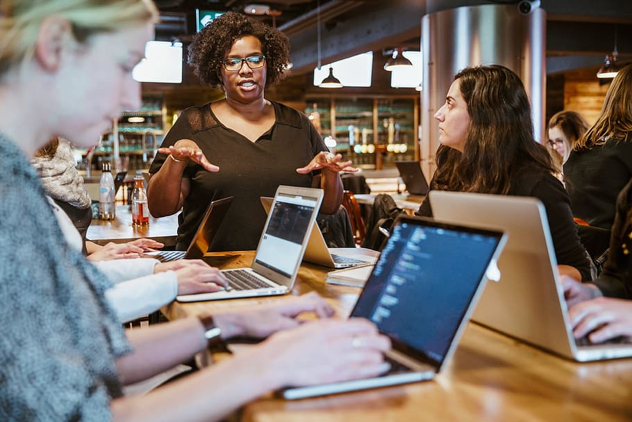 Woman Instructing On Laptop.