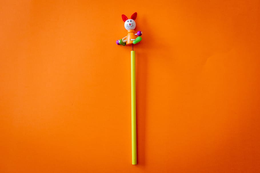Yellow and Multicolored Animal Toy on Orange Surface, colorful HD wallpaper