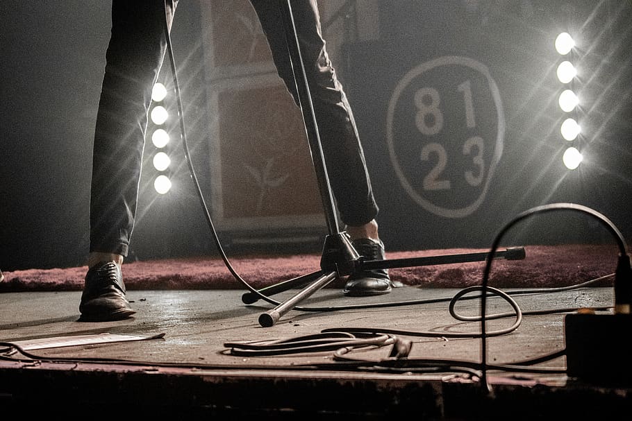 person standing on stage, low section, one person, shoe, human leg HD wallpaper
