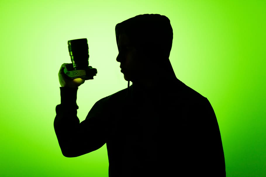 Person Holding A Camera, backlit, man, silhouette, studio shot HD wallpaper