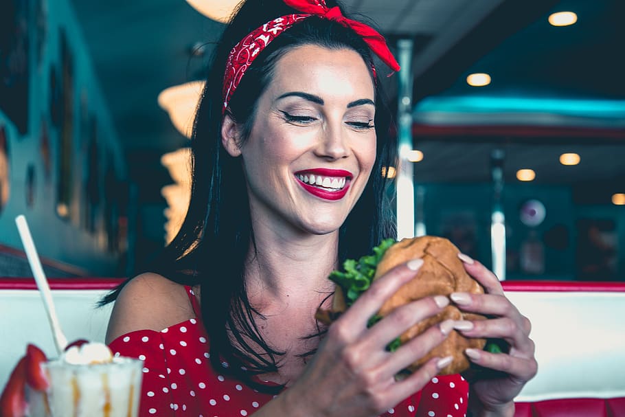 woman eats burger, young adult, food and drink, smiling, happiness HD wallpaper
