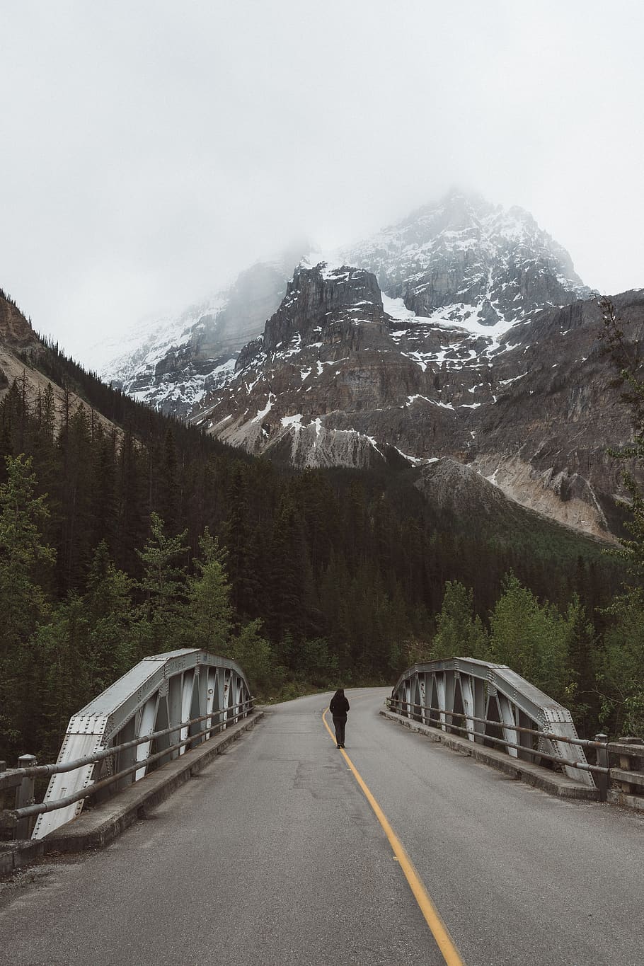 person, bridge, mountain, mountains, fog, sky, clouds, snow HD wallpaper