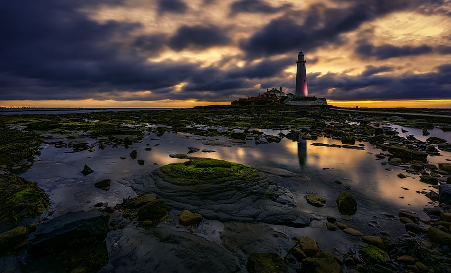 Lighthouse During Sunset, clouds, dawn, ocean, sea, seascape HD wallpaper