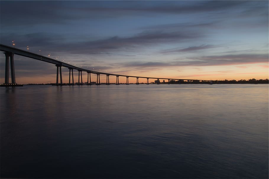 sunset, dusk, bridge, architecture, sky, night, evening, water HD wallpaper