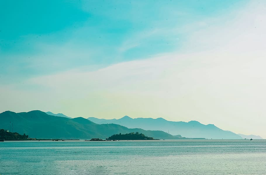 Landscape Photo of Mountain over Body of Water, clouds, daylight HD wallpaper