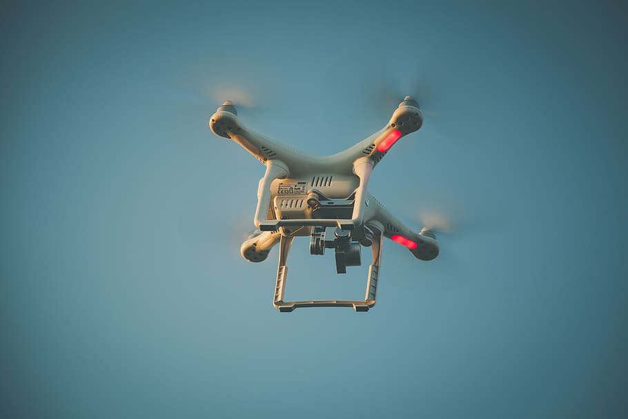 Worm's Eyeview Photo of White Quadcopter, action, aircraft, aviation