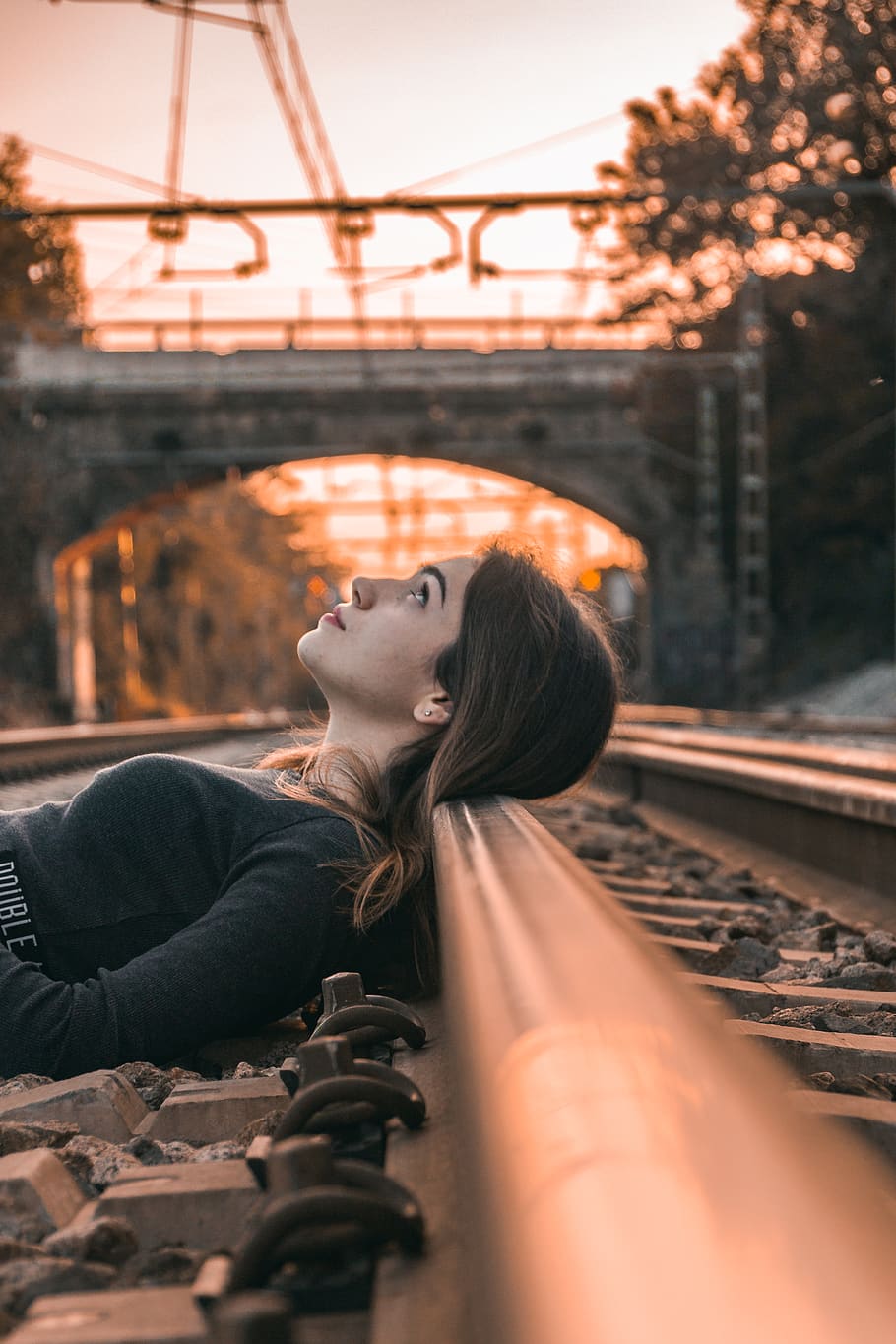 Selective Focus Photography of Woman Lying on Train Rail during Golden Hour, HD wallpaper