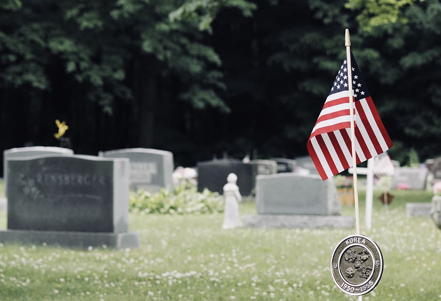 U.S. flag near graves, tomb, tombstone, funeral, american flag