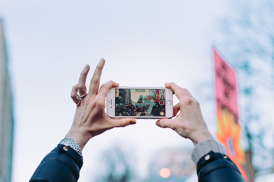 person taking photo using iPhone 6 during daytime, technology HD wallpaper