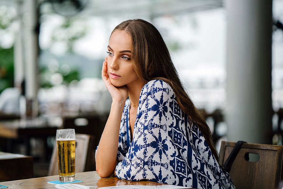 Woman in White and Blue Top Sitting in Front Table, adult, alcohol