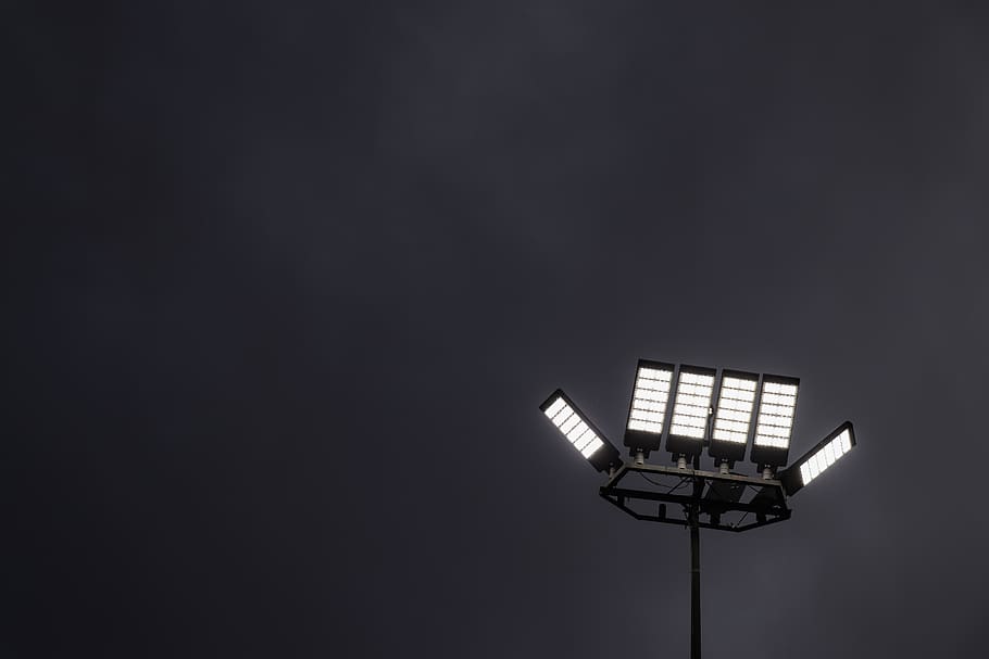 turned-on stadium lights, lighting, lamp post, patio, flashlight