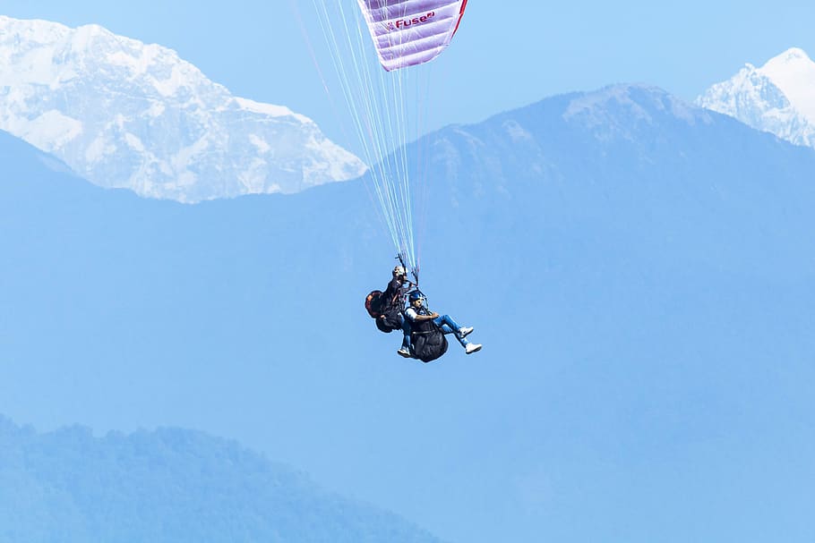 man parachuting, sport, mountain, extreme sports, mid-air, leisure activity HD wallpaper