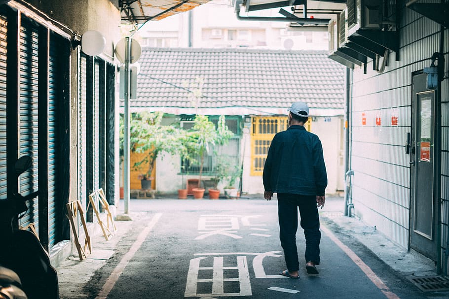 man standing between houses, human, person, apparel, clothing HD wallpaper